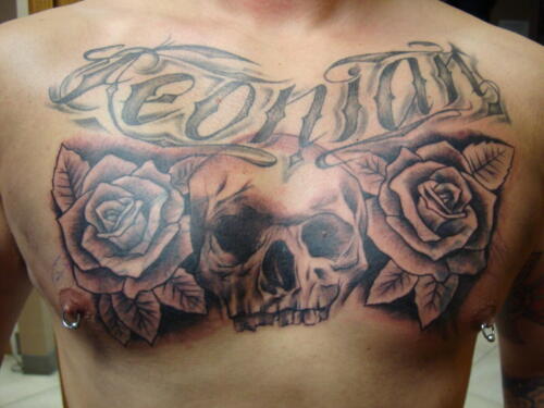 chest tattoo, skull,flowers